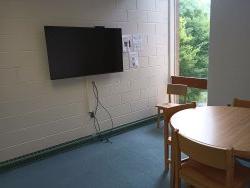 Table and chairs with monitor