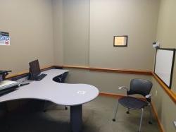 Study room with table, chair, computer and whiteboard