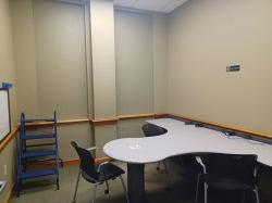 Study room with table, chair, and whiteboard