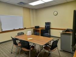 Study room with table, chairs, whiteboard and smartboard